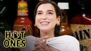 Dua Lipa Sweats from Her Eyes While Eating Spicy Wings still