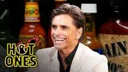 John Stamos Falls Out of His Chair While Eating Spicy Wings still