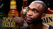 Jay Pharoah Has a Staring Contest While Eating Spicy Wings still