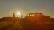 Two drivers at sunset still