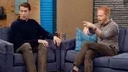 Jesse Tyler Ferguson Wears a Brown Checked Shirt and Stripey Socks still